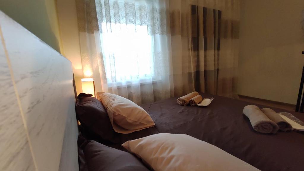 Postel nebo postele na pokoji v ubytování ICity