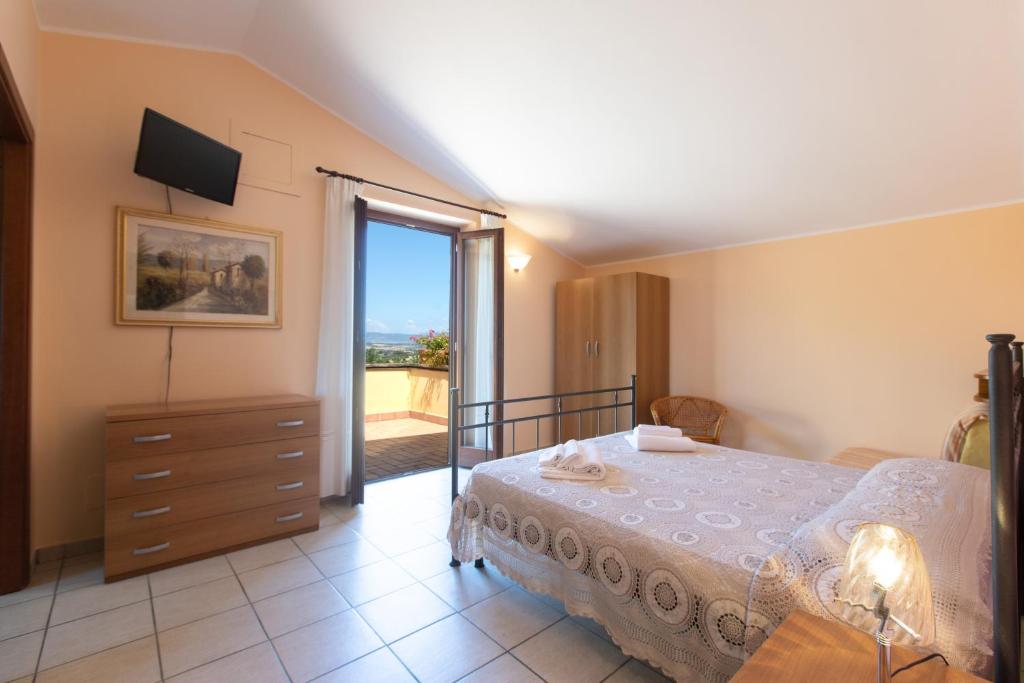 Postel nebo postele na pokoji v ubytování B&B La Casa Fra Gli Olivi