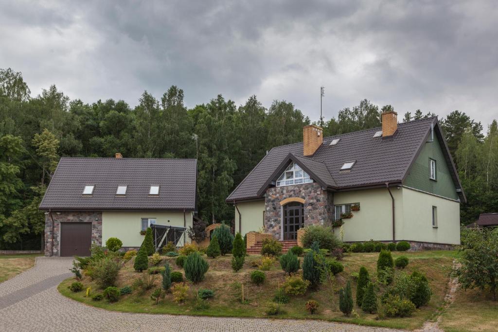 a house with a gray roof at Wypoczynek nad Wigrami in Suwałki