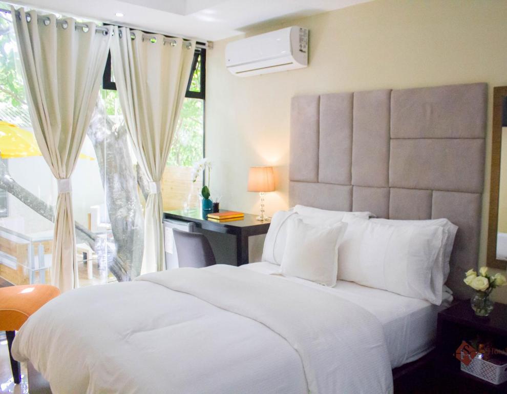 Postel nebo postele na pokoji v ubytování Hotel Santa Clara