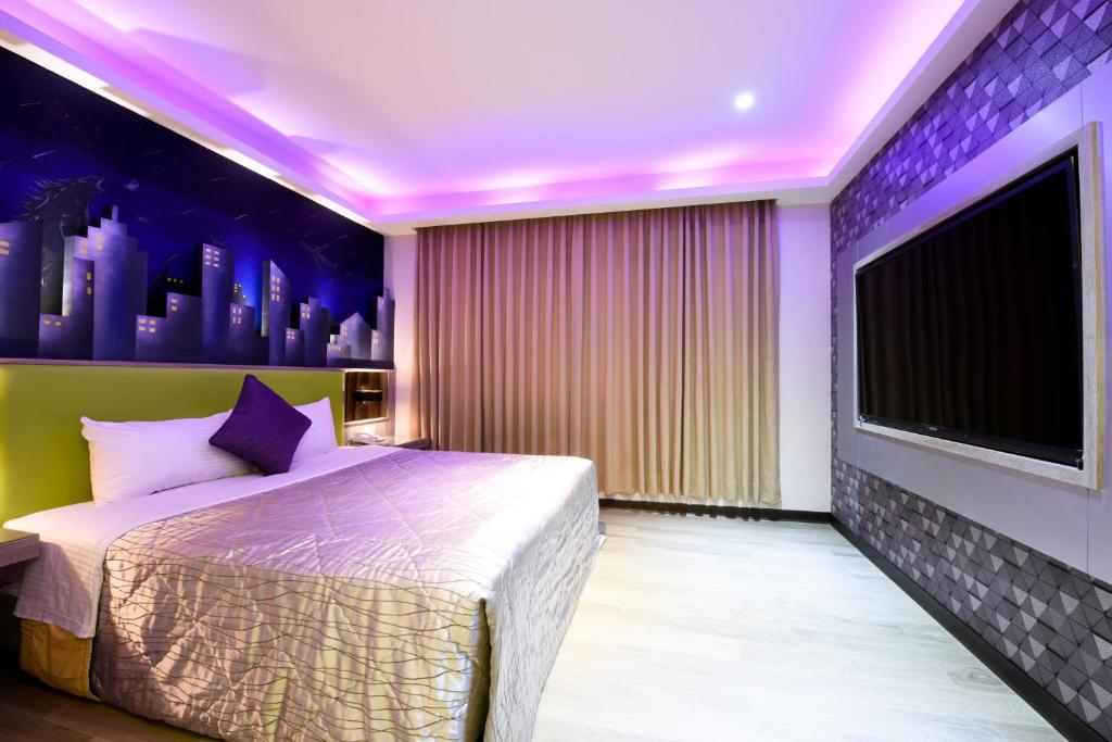 Postel nebo postele na pokoji v ubytování Carnival Motel