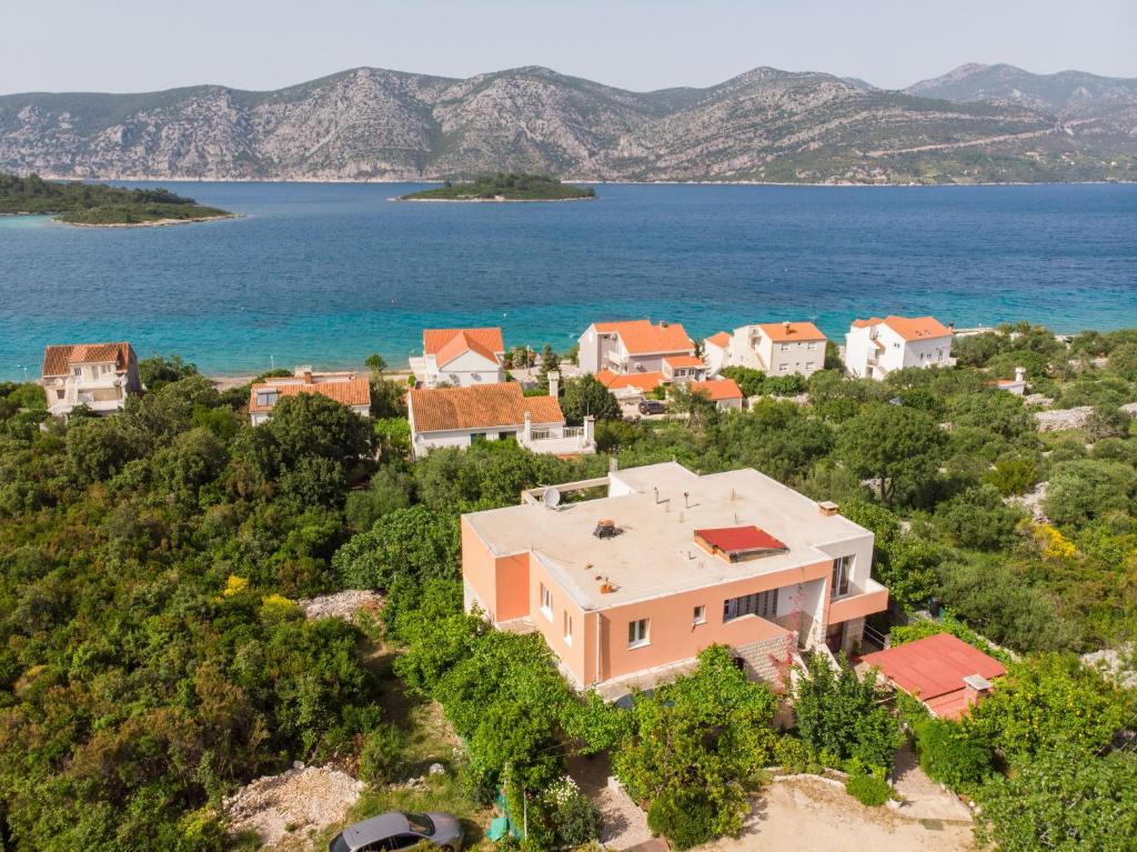an aerial view of a house on the shore of the ocean at Apartment Slavka in Račišće
