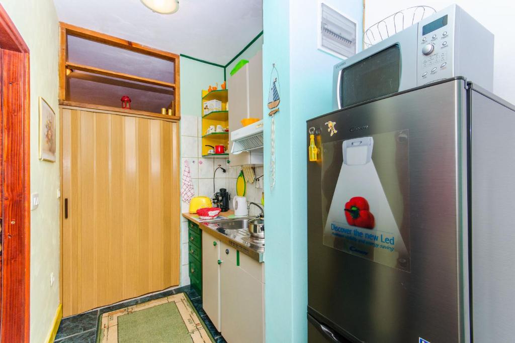 Kuchyň nebo kuchyňský kout v ubytování Apartment Slavka