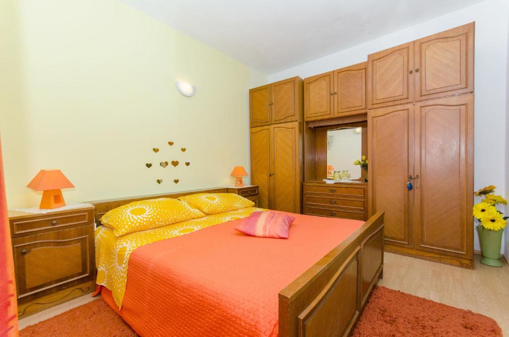 Postel nebo postele na pokoji v ubytování Apartment Slavka
