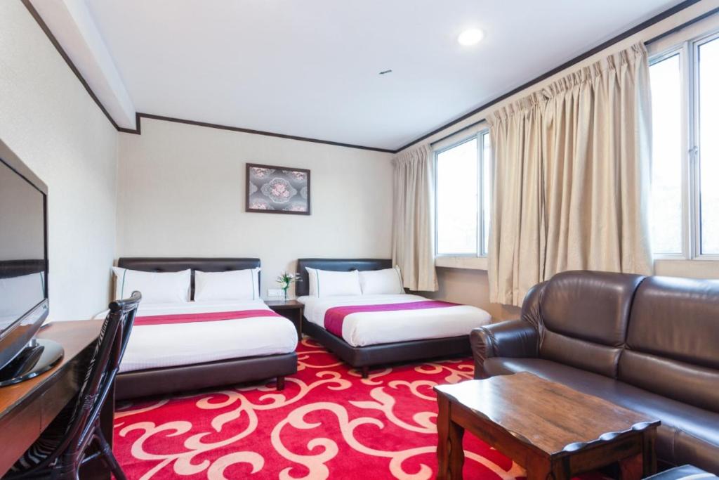 Postel nebo postele na pokoji v ubytování Hotel Vistaria