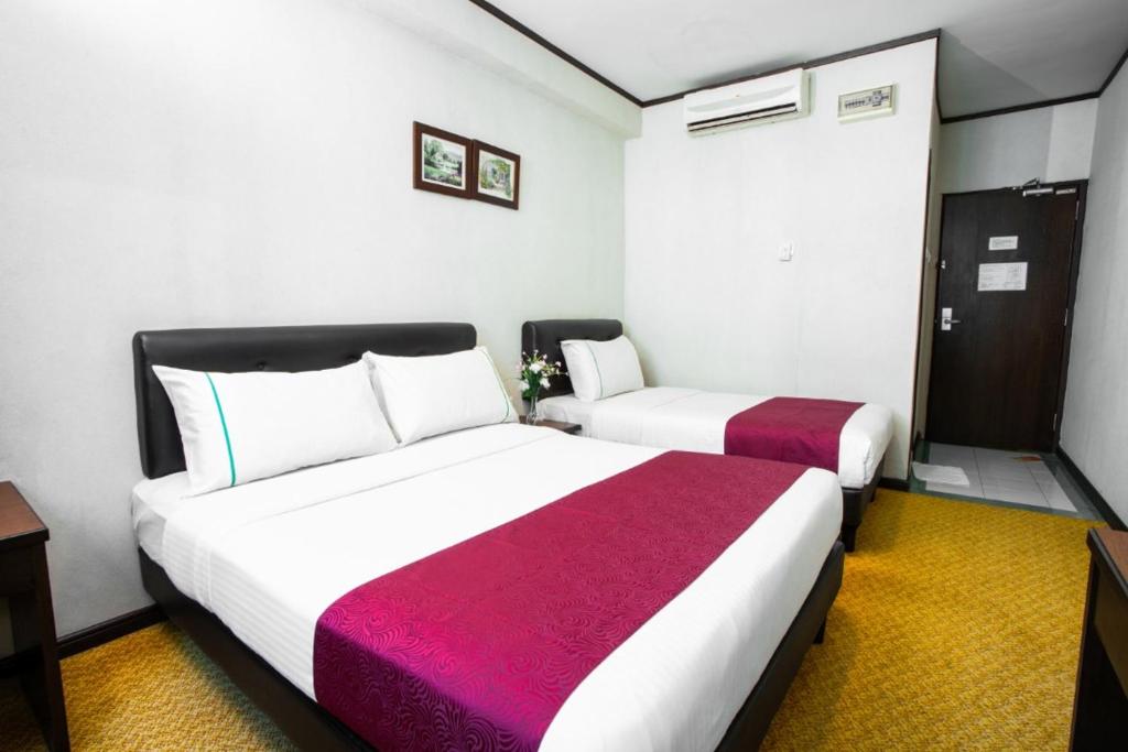Postel nebo postele na pokoji v ubytování Hotel Vistaria