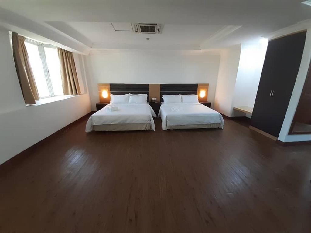 Postel nebo postele na pokoji v ubytování Sara Hotel