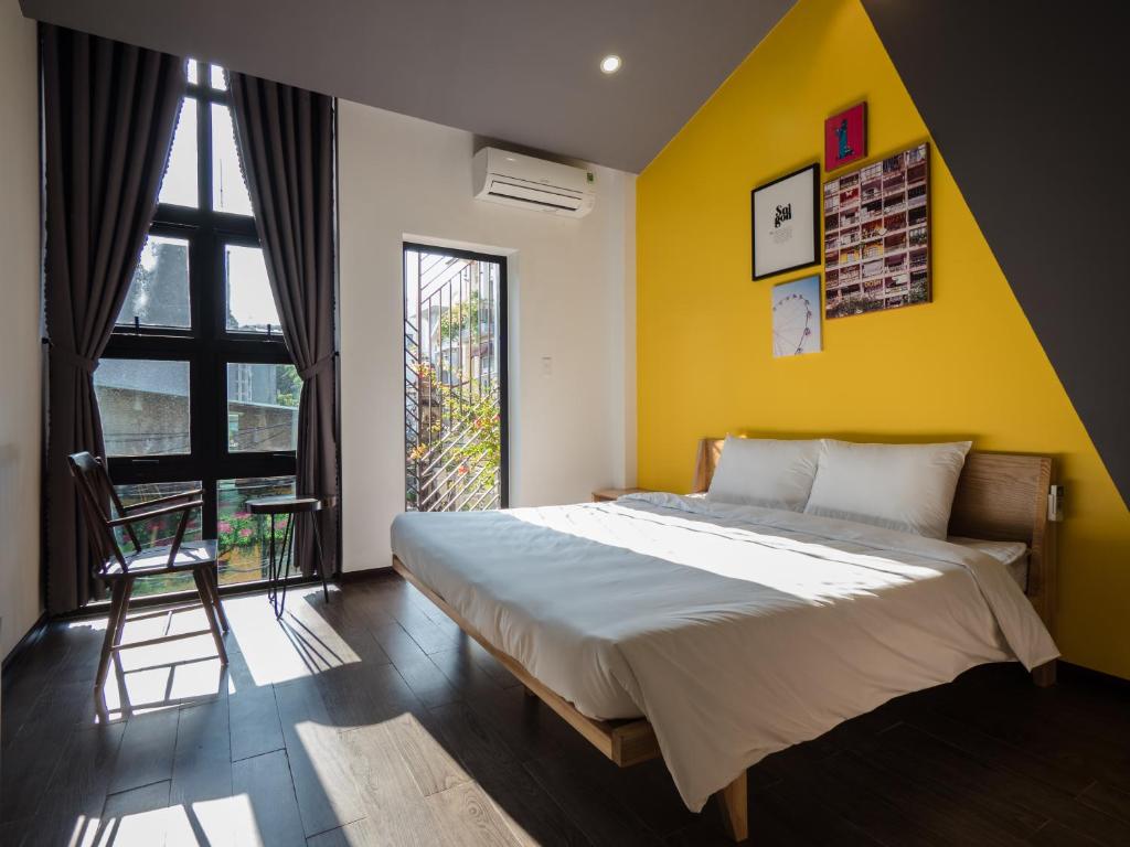 Ein Bett oder Betten in einem Zimmer der Unterkunft Wings House