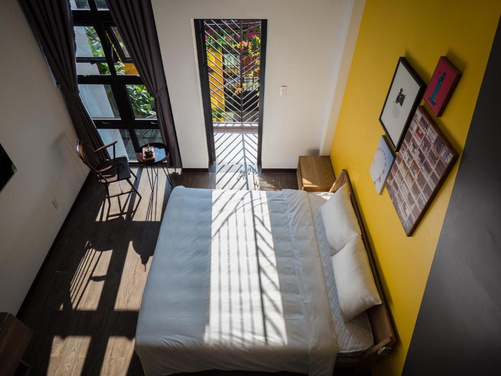 Ein Bett oder Betten in einem Zimmer der Unterkunft Wings House