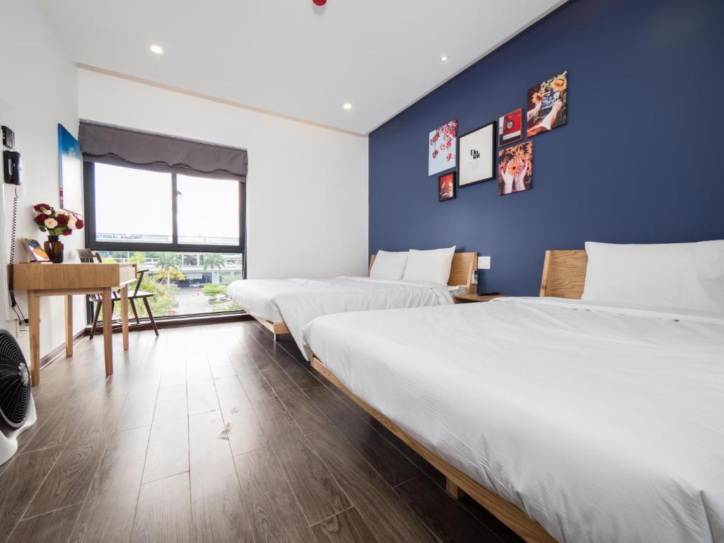 Ein Bett oder Betten in einem Zimmer der Unterkunft Wings House