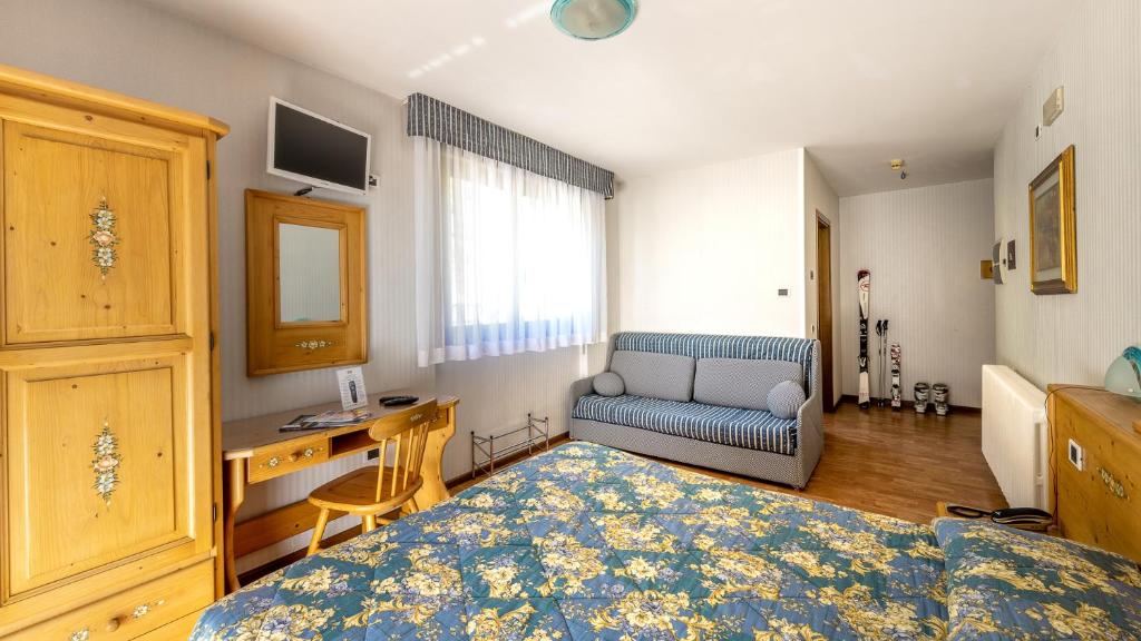 Postel nebo postele na pokoji v ubytování Hotel Club Funivia