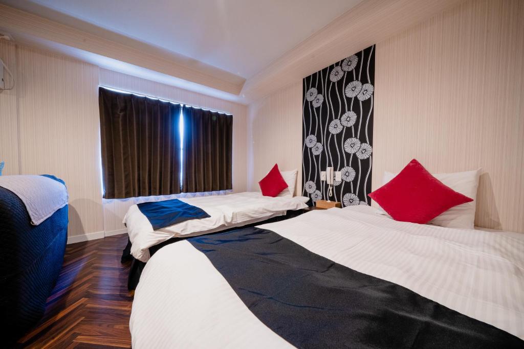 Postel nebo postele na pokoji v ubytování Hotel Pagoda