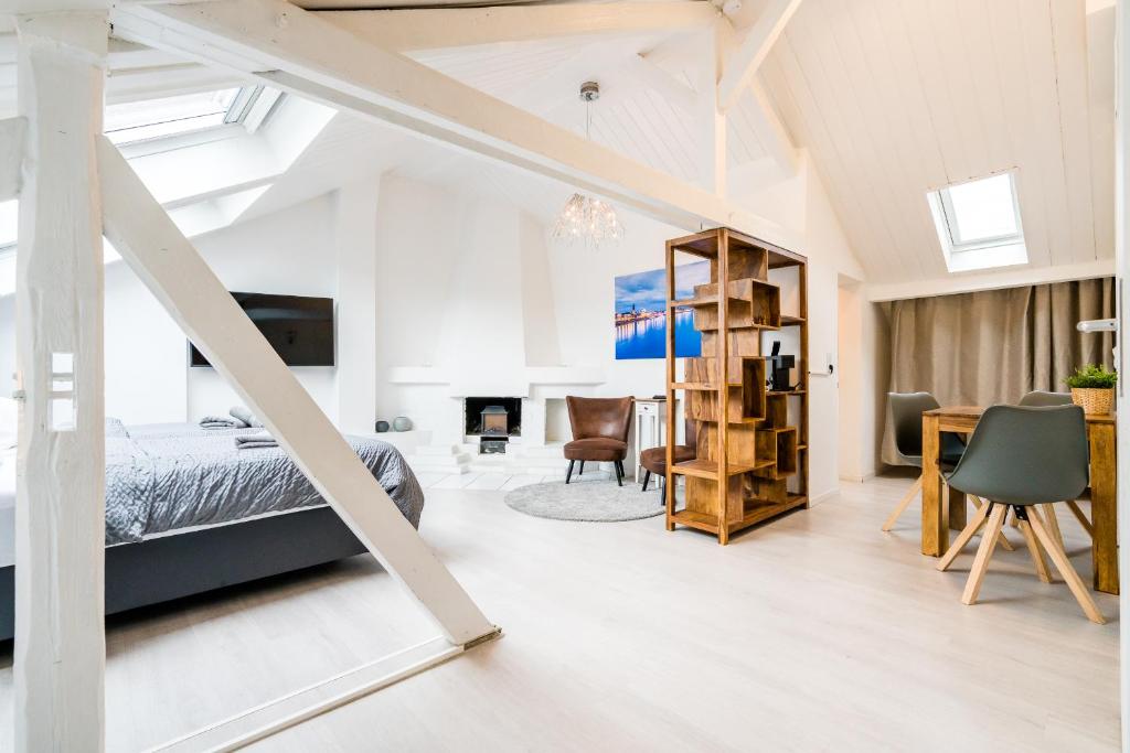 En eller flere senge i et værelse på Centerapartments Tonhallenstraße