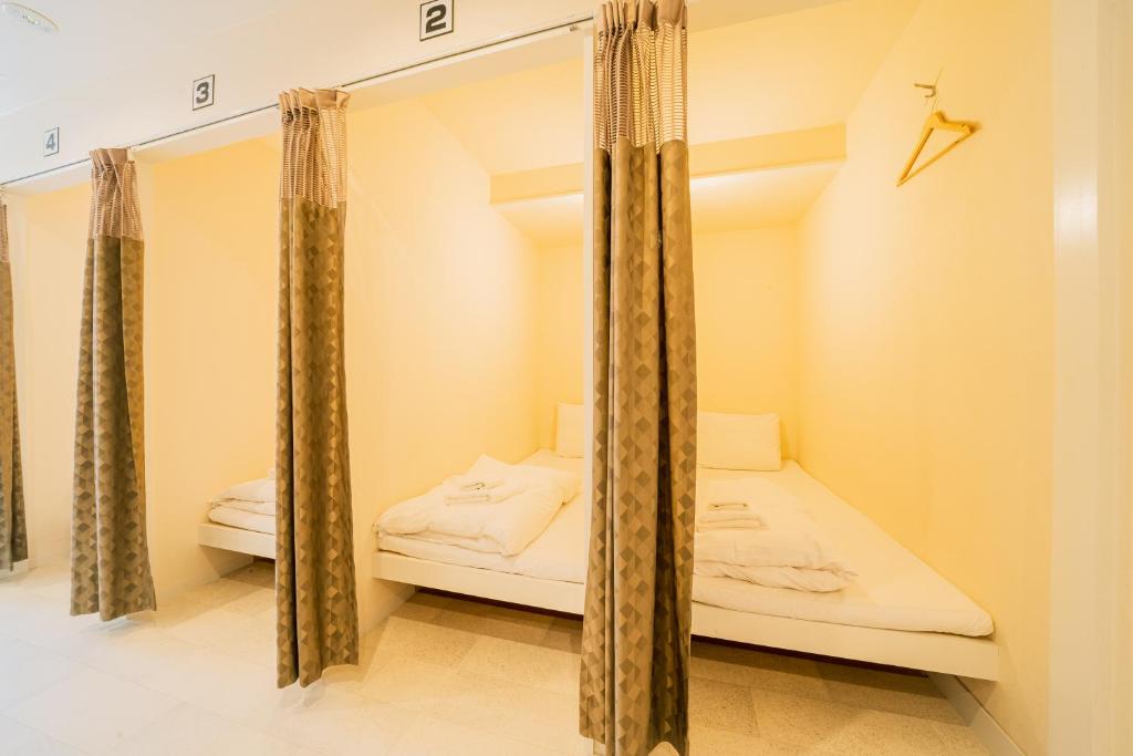 Postel nebo postele na pokoji v ubytování Hotel Pagoda