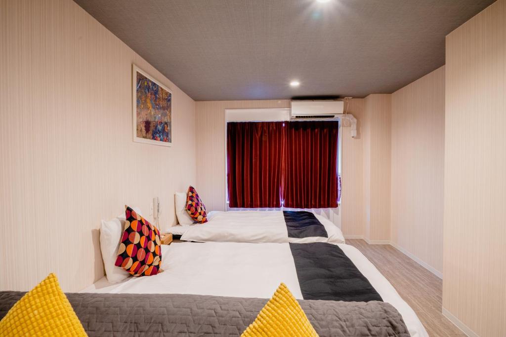 Postel nebo postele na pokoji v ubytování Hotel Pagoda