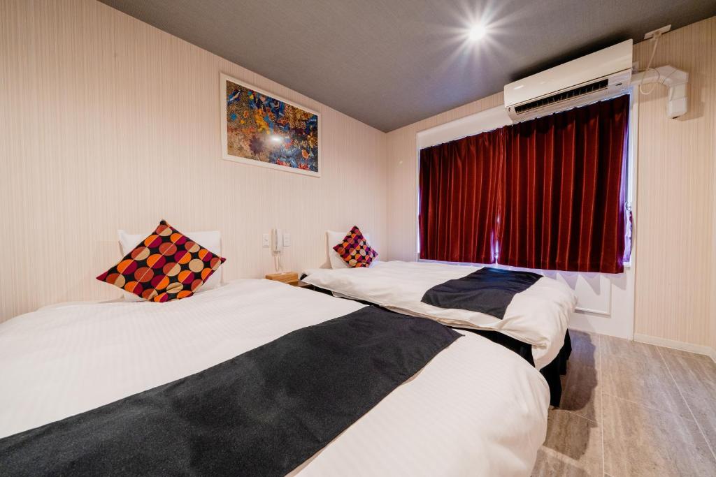 Postel nebo postele na pokoji v ubytování Hotel Pagoda