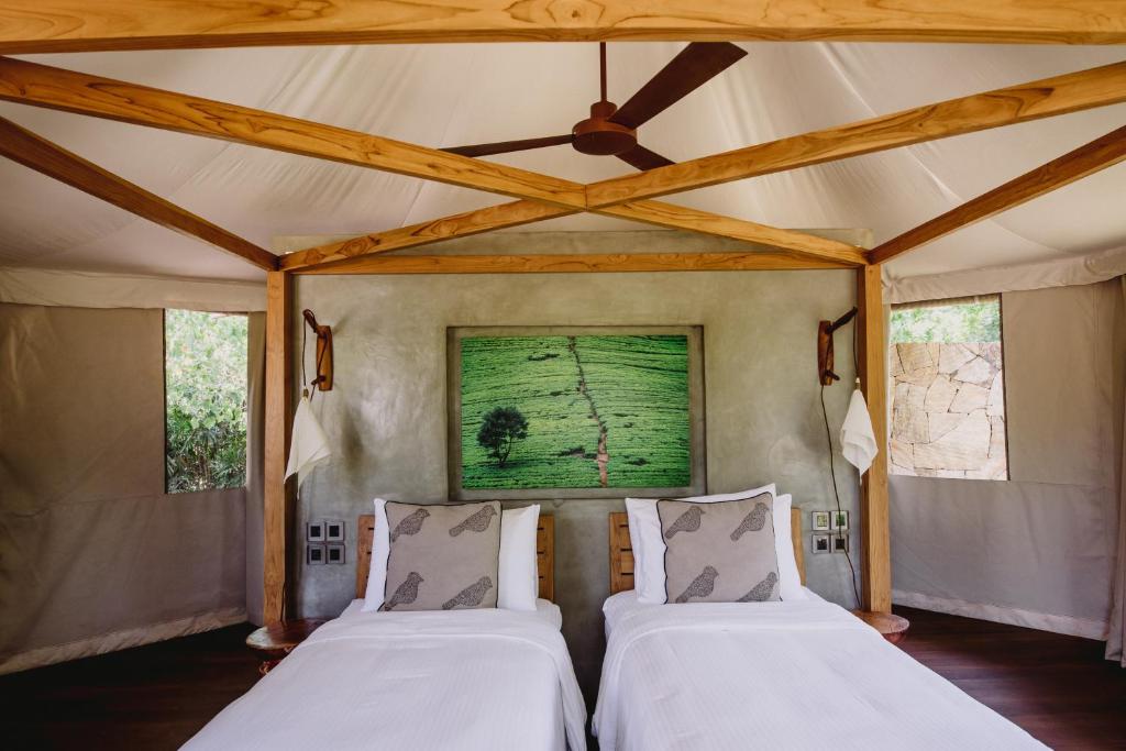 a bedroom with two beds in a tent at Karpaha Sands in Pasikuda