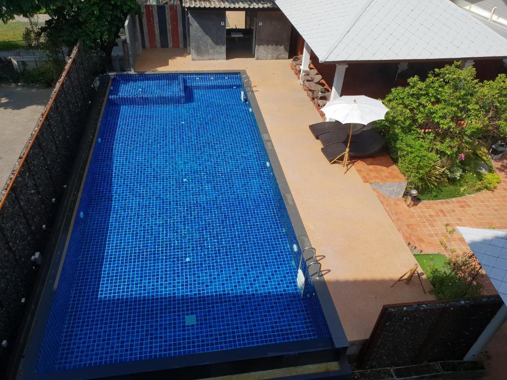 An overhead view of the rectangular pool and its small adjoining terrace.