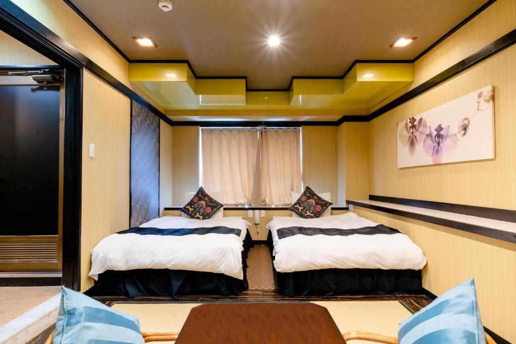 Postel nebo postele na pokoji v ubytování Hotel Pagoda