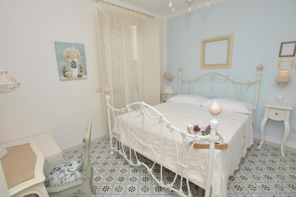Posteľ alebo postele v izbe v ubytovaní A casa di Nonna Bianca