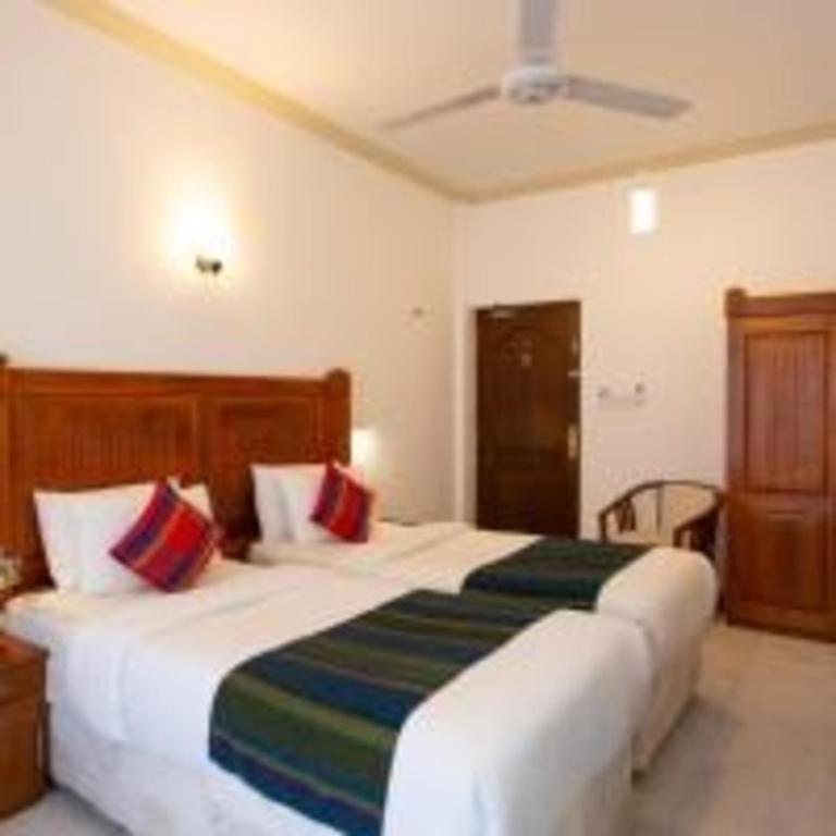 Postel nebo postele na pokoji v ubytování Hotel Yo Kandy
