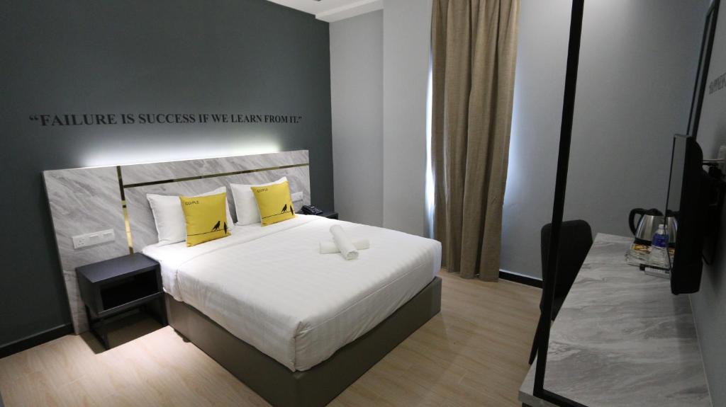 Postel nebo postele na pokoji v ubytování Hotel 99 Sepang KLIA & KLIA2