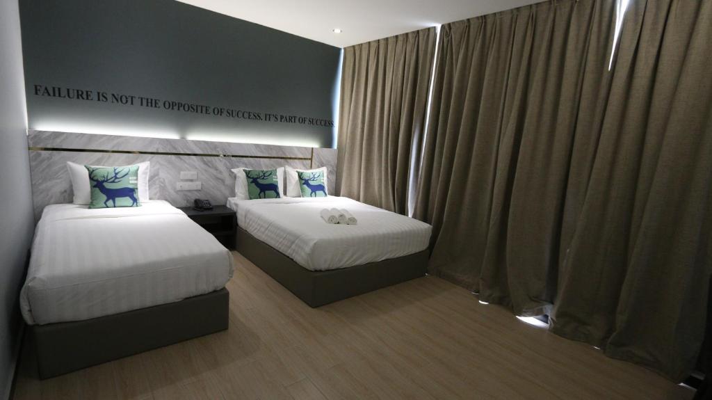 Postel nebo postele na pokoji v ubytování Hotel 99 Sepang KLIA & KLIA2