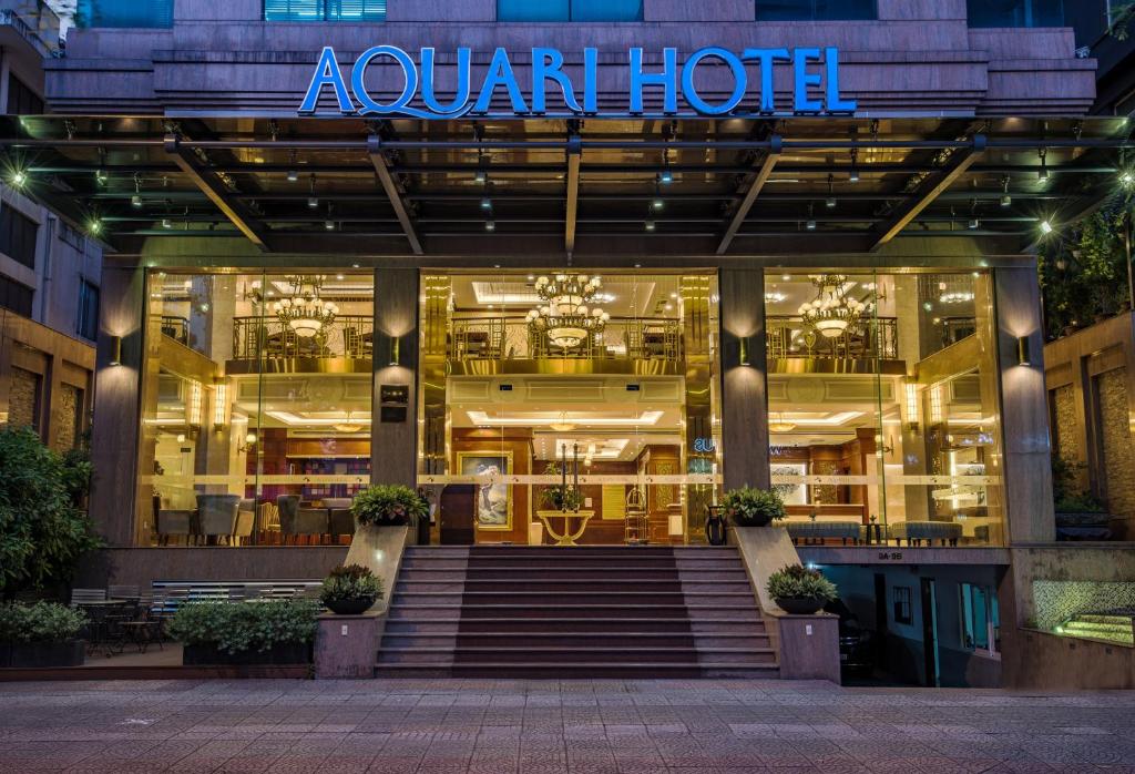 a store front of a luxury hotel at night at Aquari Hotel in Ho Chi Minh City