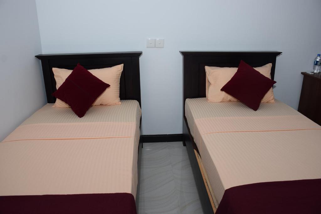 Postel nebo postele na pokoji v ubytování Gold inn