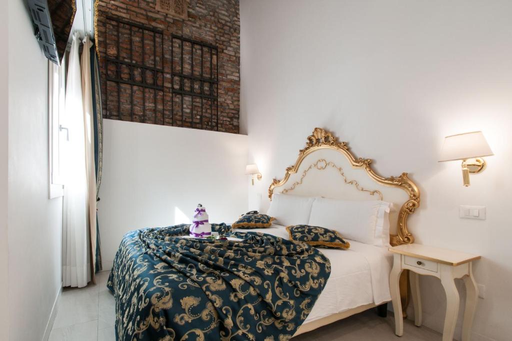 Cama ou camas em um quarto em Al Mascaron Ridente