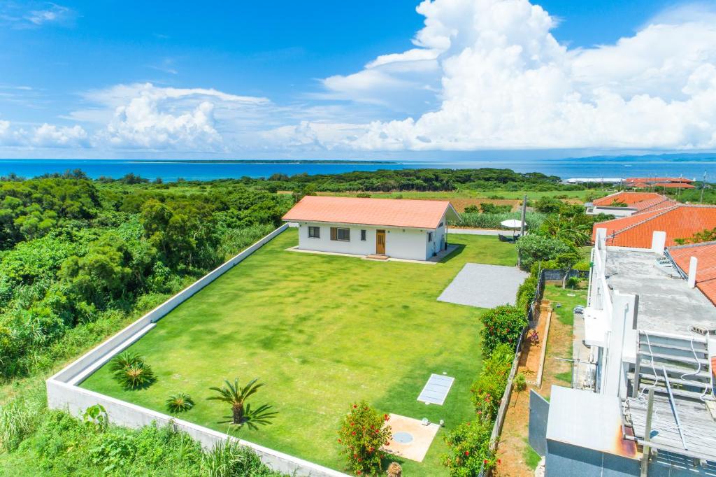 an aerial view of a house with a large yard at Sunset Hill Ishigaki in Ishigaki Island