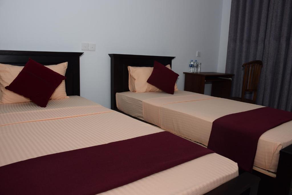 Postel nebo postele na pokoji v ubytování Gold inn