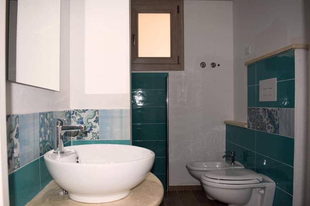 Koupelna v ubytování Corallo Rooms