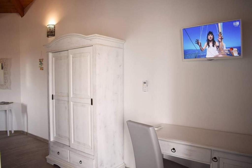 TV a/nebo společenská místnost v ubytování Corallo Rooms