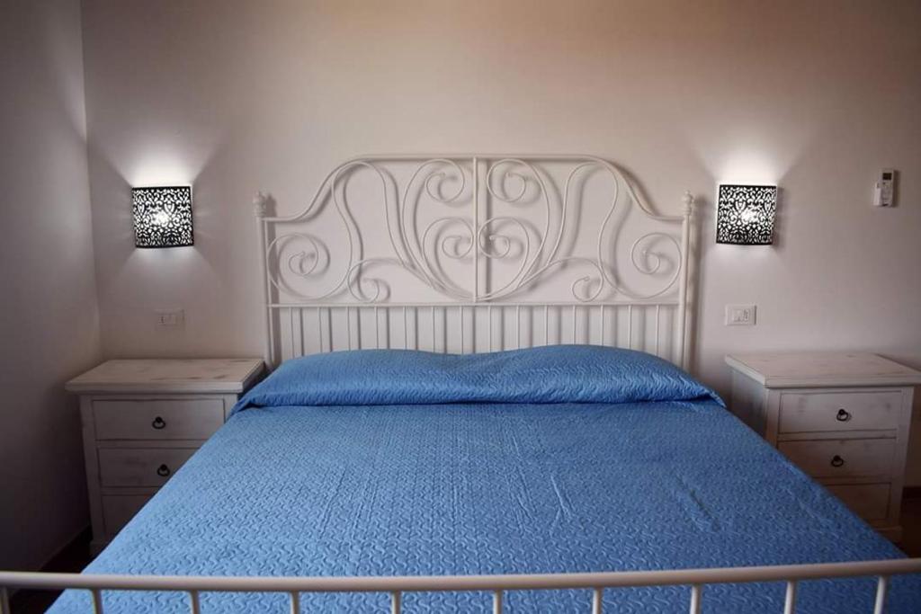 Postel nebo postele na pokoji v ubytování Corallo Rooms