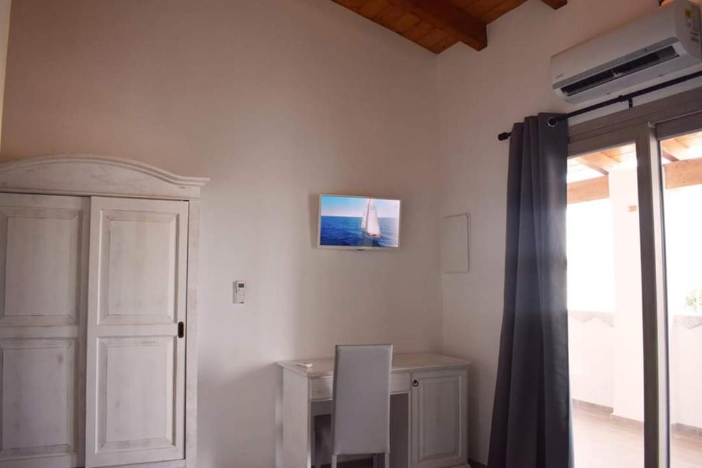 TV a/nebo společenská místnost v ubytování Corallo Rooms