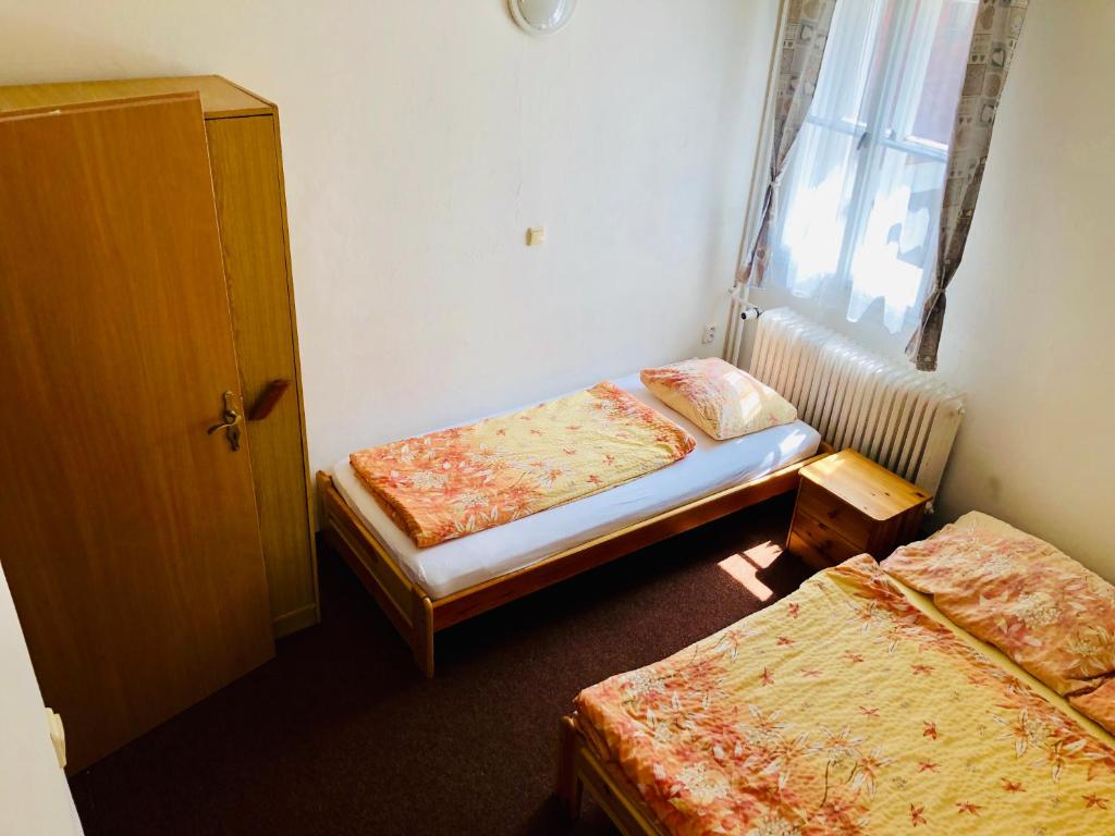 Postel nebo postele na pokoji v ubytování Penzion horská chata Světlá
