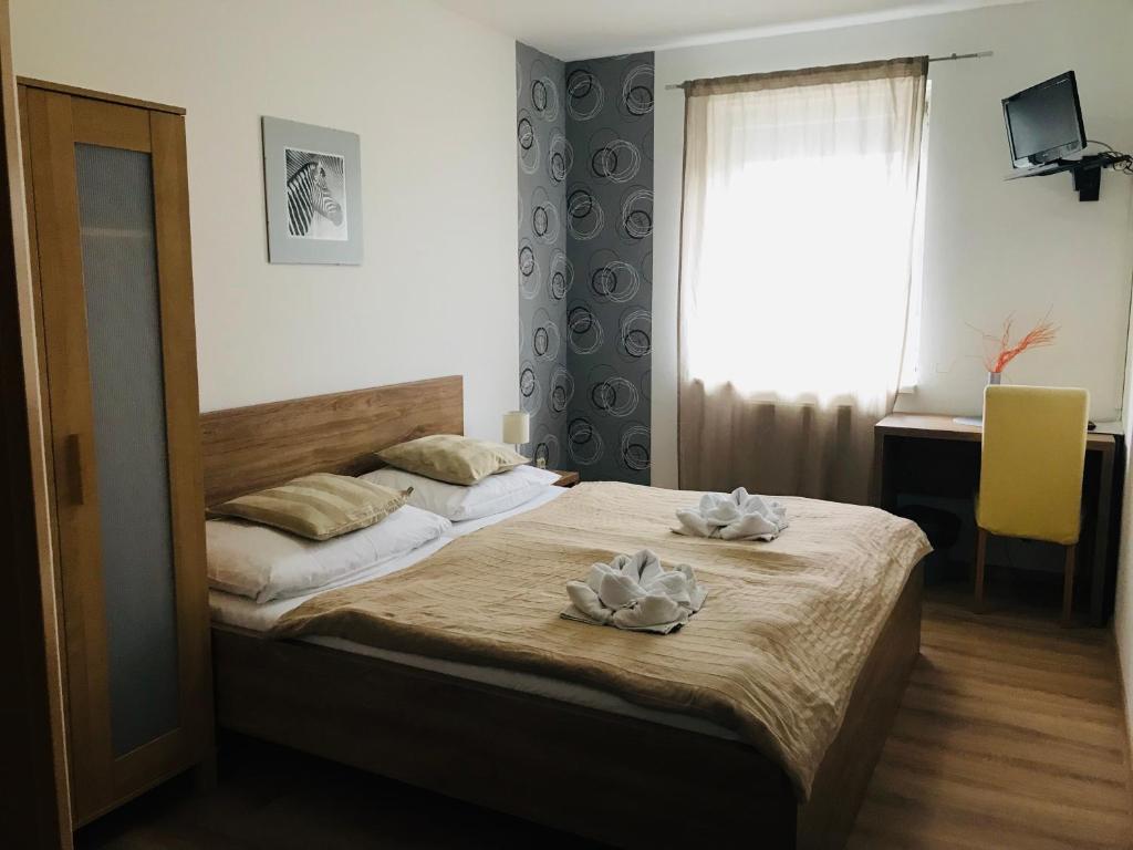 Postel nebo postele na pokoji v ubytování Hotel Orlan