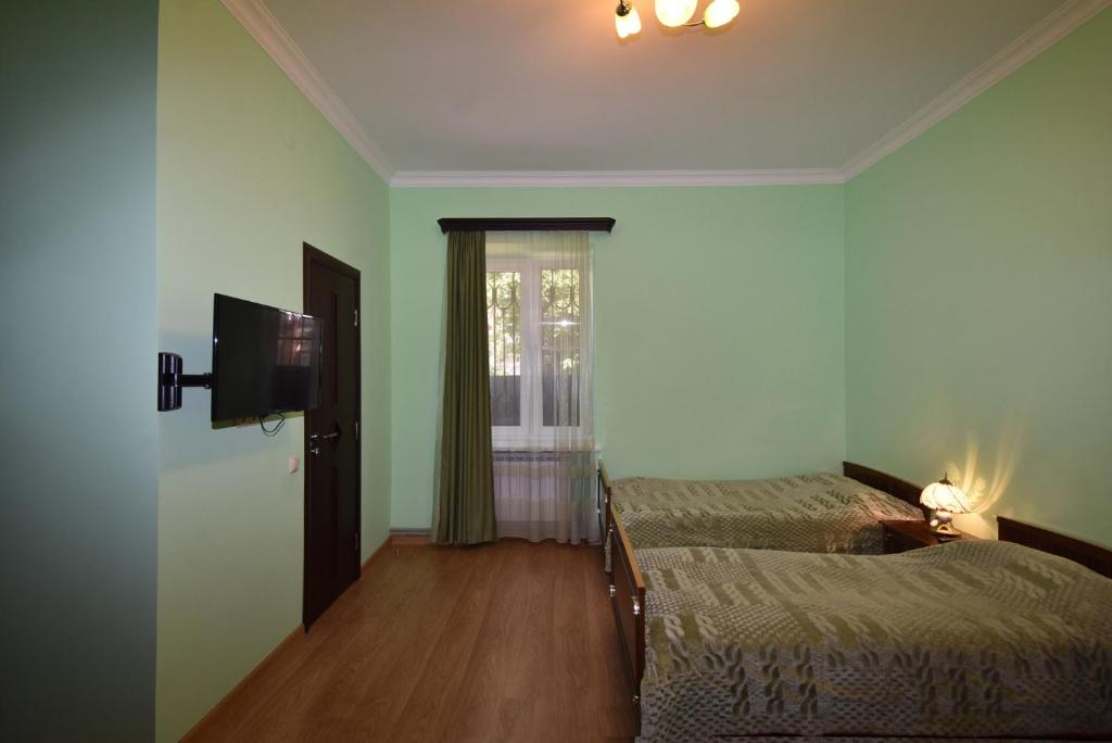 Postel nebo postele na pokoji v ubytování Guest House Arsan