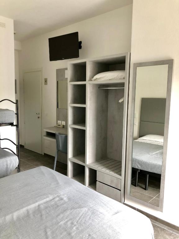 Postel nebo postele na pokoji v ubytování Hotel Eugenio