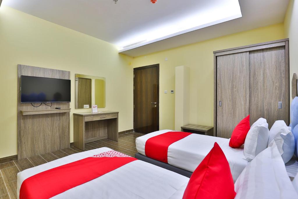 Postel nebo postele na pokoji v ubytování Shahad Alola Serviced apartments