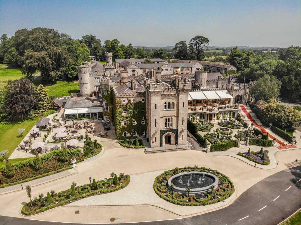 an aerial view of a large mansion with a garden at Cabra Castle Hotel in Kingscourt