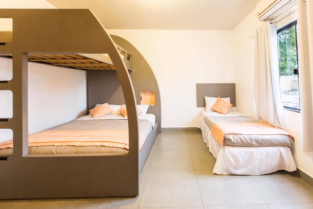 Postel nebo postele na pokoji v ubytování Concept Design Hostel & Suites