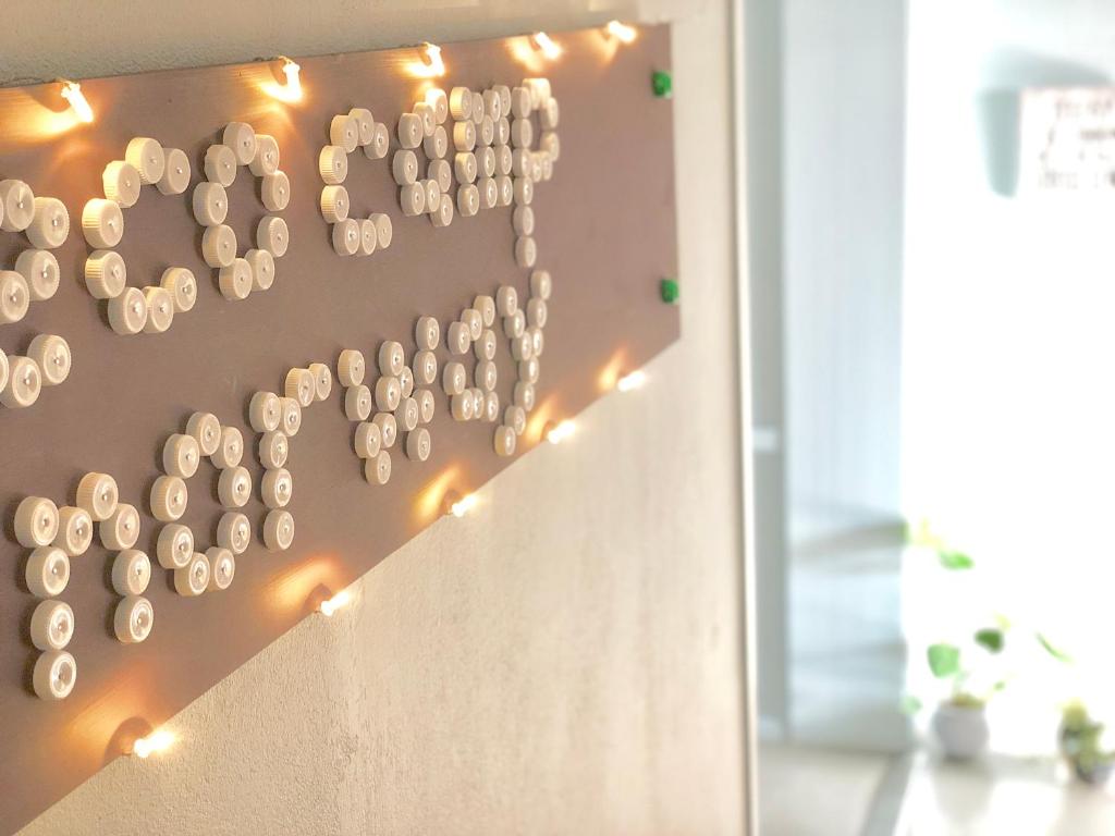 a wall with a bunch of wine corks at Eco Camp Norway in Smøla