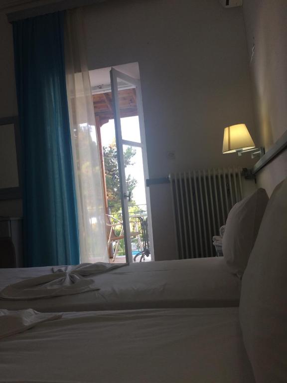 Posteľ alebo postele v izbe v ubytovaní Paradisos Studios