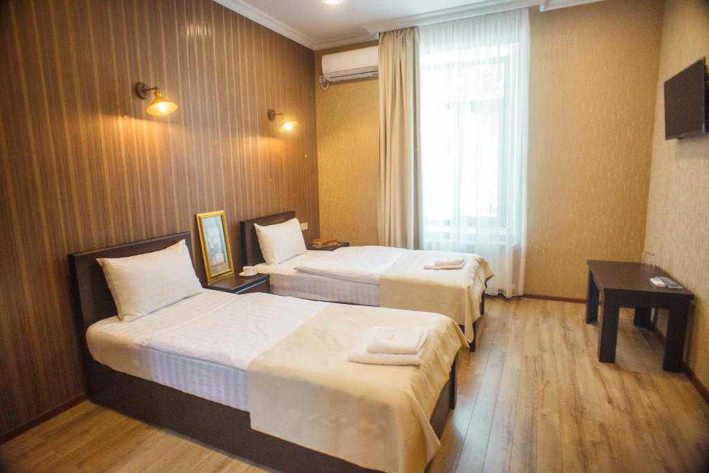 Voodi või voodid majutusasutuse Hotel Almi toas