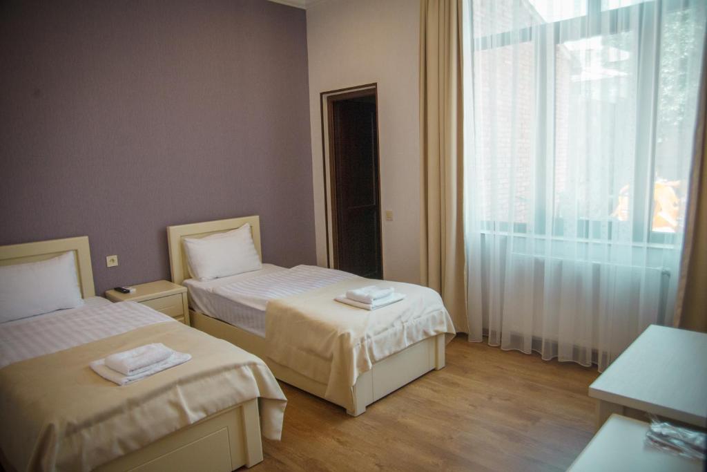 Voodi või voodid majutusasutuse Hotel Almi toas