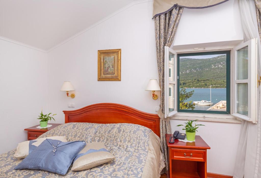 Postel nebo postele na pokoji v ubytování Hotel Ostrea