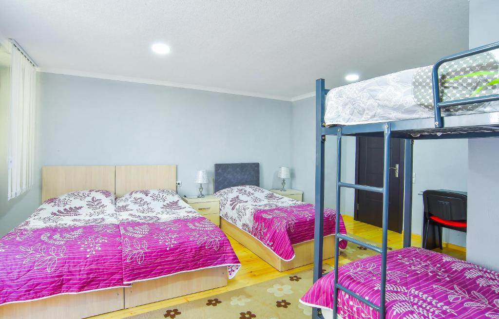 Postel nebo postele na pokoji v ubytování Hotel 9th Sky
