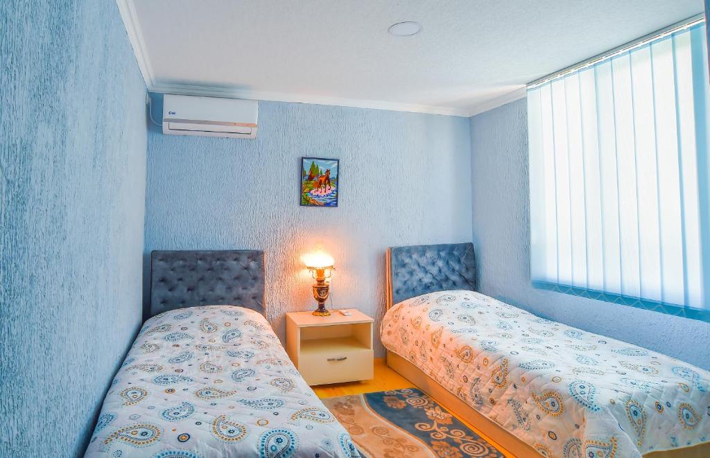 Postel nebo postele na pokoji v ubytování Hotel 9th Sky